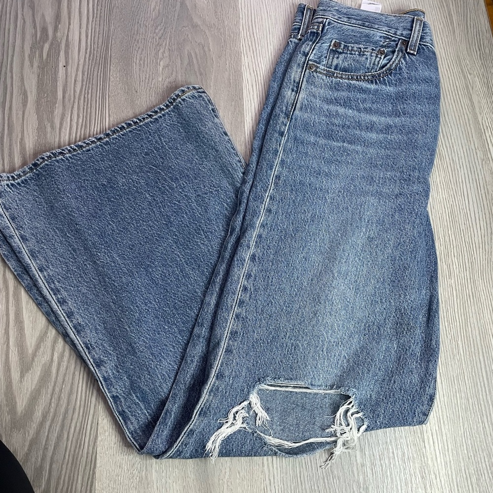 Classic Blue Women’s Denim Jeans with Distressed Knee